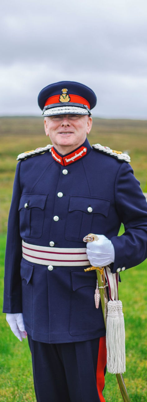 Iain Macaulay holding remembrance wreath